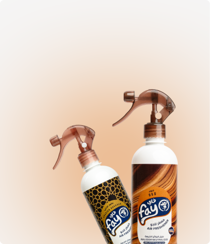 Two bottles of Fay air freshener on a gradient background
